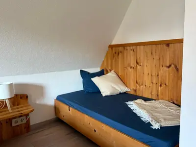 Ein Bett oder Betten in einem Zimmer der Unterkunft Schlesierweg-Apartments