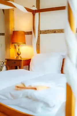 Ein Bett oder Betten in einem Zimmer der Unterkunft Unik Villa - Fewo im Oberharz Frühstück Halbpension buchbar