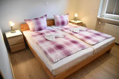 Ein Bett oder Betten in einem Zimmer der Unterkunft Roter Beer