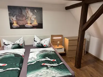 Ein Bett oder Betten in einem Zimmer der Unterkunft Am Graben 2