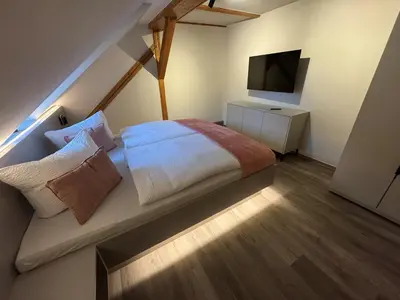 Ein Bett oder Betten in einem Zimmer der Unterkunft Stilapartment City 3