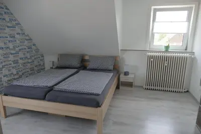 Ein Bett oder Betten in einem Zimmer der Unterkunft Ferienwohnung Wolfswiese