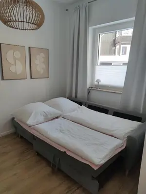Ein Bett oder Betten in einem Zimmer der Unterkunft Jesses Harzsuite