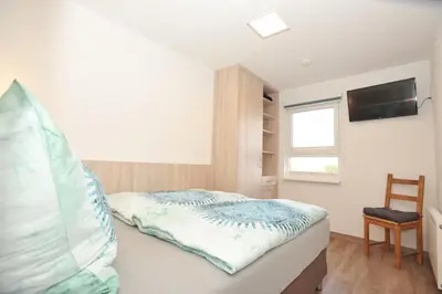 Ein Bett oder Betten in einem Zimmer der Unterkunft Ferienhaus Fuchswinkel