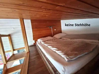 Ein Bett oder Betten in einem Zimmer der Unterkunft Ferienwohnung Tannenhöhe direkt am Wald