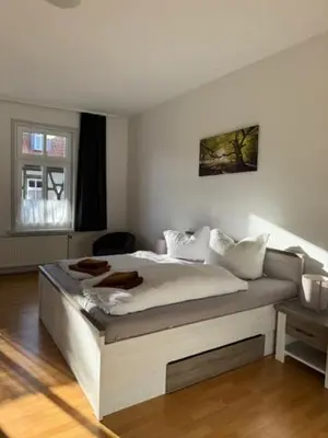 Ein Bett oder Betten in einem Zimmer der Unterkunft Ferienwohnungen Am Westerntor Amber Pepe und Paula inkl Parkplatz