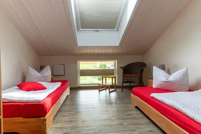 Ein Bett oder Betten in einem Zimmer der Unterkunft Ferienwohnung Haus Sonnenschein mit E-Ladesäule