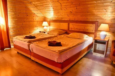 Ein Bett oder Betten in einem Zimmer der Unterkunft Auerhahn Ferienhäuser Auerhahn 319