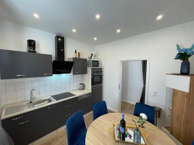 Küche/Küchenzeile in der Unterkunft Komfort Apartments am Badepark, Modern! Stylisch! Geräumig!