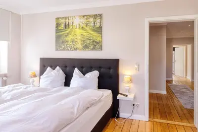 Ein Bett oder Betten in einem Zimmer der Unterkunft Ferienwohnungen Ziesing
