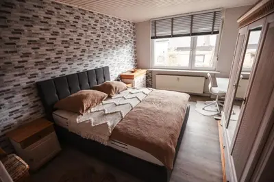Ein Bett oder Betten in einem Zimmer der Unterkunft Ferienwohnung Rose