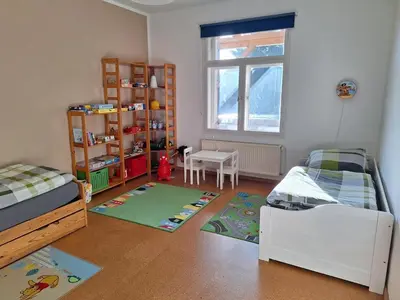 Ein Bett oder Betten in einem Zimmer der Unterkunft Familienfreundliche Ferienwohnung