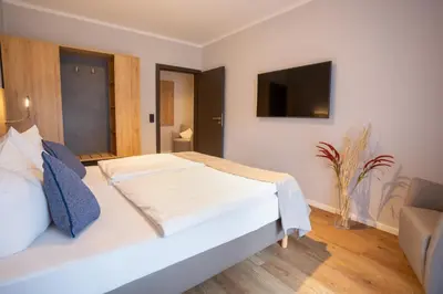 Ein Bett oder Betten in einem Zimmer der Unterkunft Chalet Bergzeit Family Wellness Suite