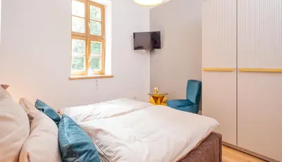 Ein Bett oder Betten in einem Zimmer der Unterkunft Harz Huus Apartments 