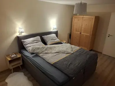 Ein Bett oder Betten in einem Zimmer der Unterkunft FeBo am Wolfsgarten