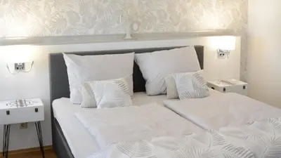 Ein Bett oder Betten in einem Zimmer der Unterkunft Fachwerkhaus im Herzen von Halberstadt