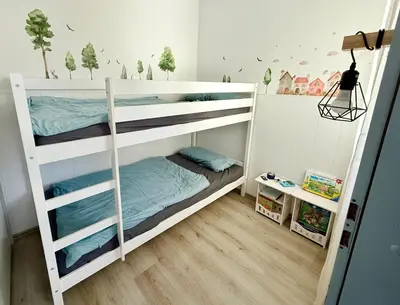 Ein Bett oder Betten in einem Zimmer der Unterkunft Family Lodge - familienfreundliches Appartement mit zwei Schlafzimmern im Ferienpark Hahnenklee