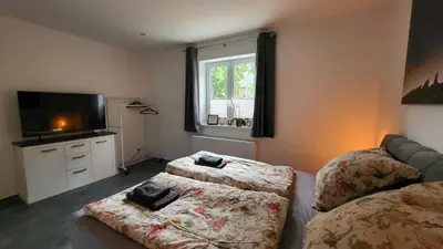 Ein Bett oder Betten in einem Zimmer der Unterkunft Heinrichs Ferienwohnungen Quedlinburg