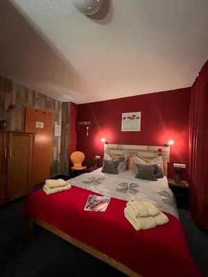Ein Bett oder Betten in einem Zimmer der Unterkunft Pension Mühlhahn