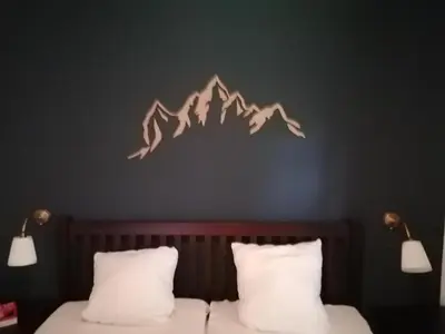 Ein Bett oder Betten in einem Zimmer der Unterkunft Das Eulennest