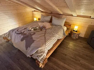 Ein Bett oder Betten in einem Zimmer der Unterkunft Harz - Blockhaus mit Sauna und Kamin, 4 und 5 Sterne, CH