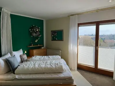 Ein Bett oder Betten in einem Zimmer der Unterkunft Ferienwohnung KaLü 4a