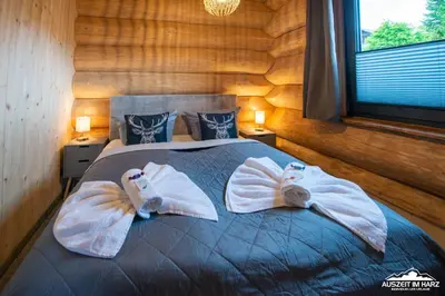 Ein Bett oder Betten in einem Zimmer der Unterkunft Auszeit im Harz - Haus 9 Blockhaus Alina