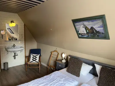 Ein Bett oder Betten in einem Zimmer der Unterkunft Ferienwohnung Oerdheks