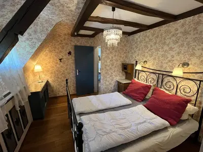 Ein Bett oder Betten in einem Zimmer der Unterkunft Ferienwohnung Waldhexe in der Villa Brockenhexe