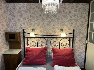 Ein Bett oder Betten in einem Zimmer der Unterkunft Ferienwohnung Waldhexe in der Villa Brockenhexe