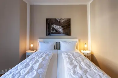 Ein Bett oder Betten in einem Zimmer der Unterkunft Ferienwohnung Morgenrot in der Villa Harzer Flair