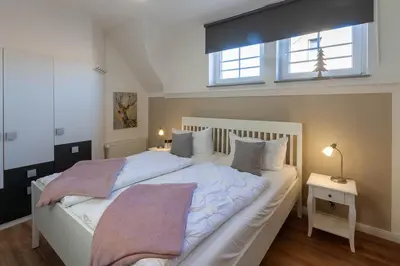 Ein Bett oder Betten in einem Zimmer der Unterkunft Ferienwohnung Abendsonne in der Villa Harzer Flair