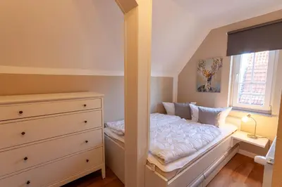 Ein Bett oder Betten in einem Zimmer der Unterkunft Ferienwohnung Abendsonne in der Villa Harzer Flair