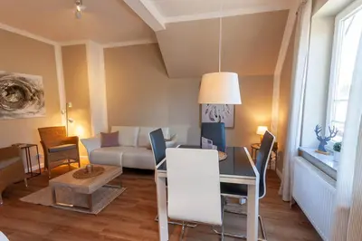 Ein Sitzbereich in der Unterkunft Ferienwohnung Abendsonne in der Villa Harzer Flair