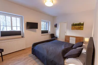 Ein Bett oder Betten in einem Zimmer der Unterkunft Ferienwohnung Hexenglück mit Balkon