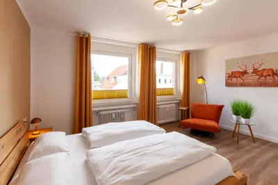 Ein Bett oder Betten in einem Zimmer der Unterkunft Ferienwohnung Am Bach 3 mit Balkon