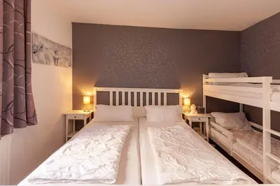 Ein Bett oder Betten in einem Zimmer der Unterkunft Ferienwohnung Wurmbergstation