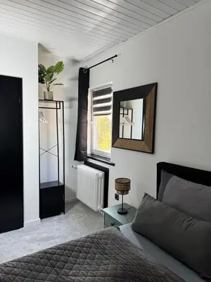 Ein Bett oder Betten in einem Zimmer der Unterkunft Ferienwohnung Grüne Auszeit Braunlage