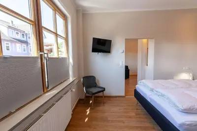 Ein Bett oder Betten in einem Zimmer der Unterkunft Ferienwohnung Waldfrieden 2 mit Garten und Grill