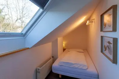Ein Bett oder Betten in einem Zimmer der Unterkunft Ferienwohnung Harzer Hütte mit Balkon