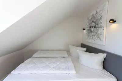 Ein Bett oder Betten in einem Zimmer der Unterkunft Ferienwohnung Harzer Hütte mit Balkon