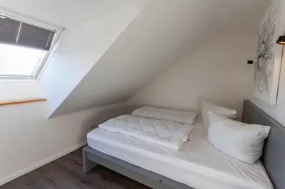 Ein Bett oder Betten in einem Zimmer der Unterkunft Ferienwohnung Harzer Hütte mit Balkon
