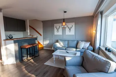 Ein Sitzbereich in der Unterkunft Ferienwohnung Harzer Hütte mit Balkon