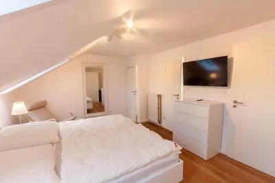 Ein Bett oder Betten in einem Zimmer der Unterkunft Ferienwohnung Blickfang mit Balkon und Traumblick