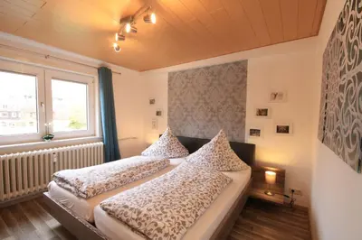 Ein Bett oder Betten in einem Zimmer der Unterkunft Ferienwohnung Hexenbaude