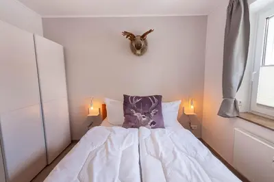 Ein Bett oder Betten in einem Zimmer der Unterkunft Ferienwohnung Bergverliebt mit Balkon und Traumblick