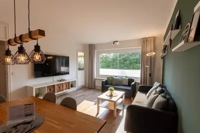 Ein Sitzbereich in der Unterkunft Ferienwohnung Somnia mit Balkon