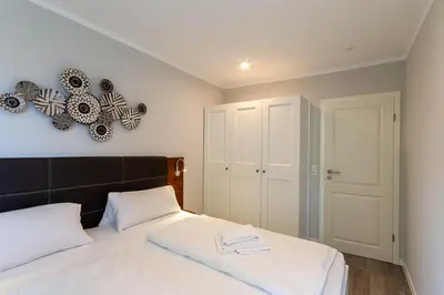 Ein Bett oder Betten in einem Zimmer der Unterkunft Ferienwohnung Harzlaune mit Balkon und Wurmbergblick