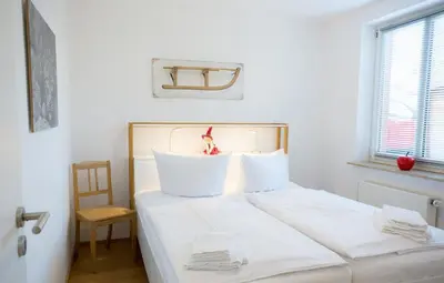 Ein Bett oder Betten in einem Zimmer der Unterkunft Ferienwohnung Oberharzer Bergluft mit Balkon