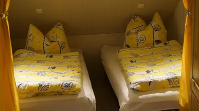 Ein Bett oder Betten in einem Zimmer der Unterkunft Pension im Glück Thale